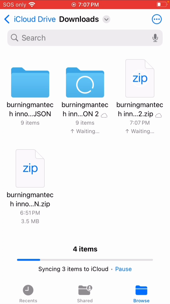 The downloaded ZIP and extracted GeoJSON folder in the Files app